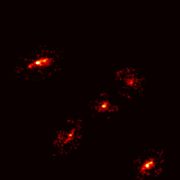 A Newly Discovered ‘Einstein’s Cross’ Reveals the Existence of a Giant Dark Matter Halo